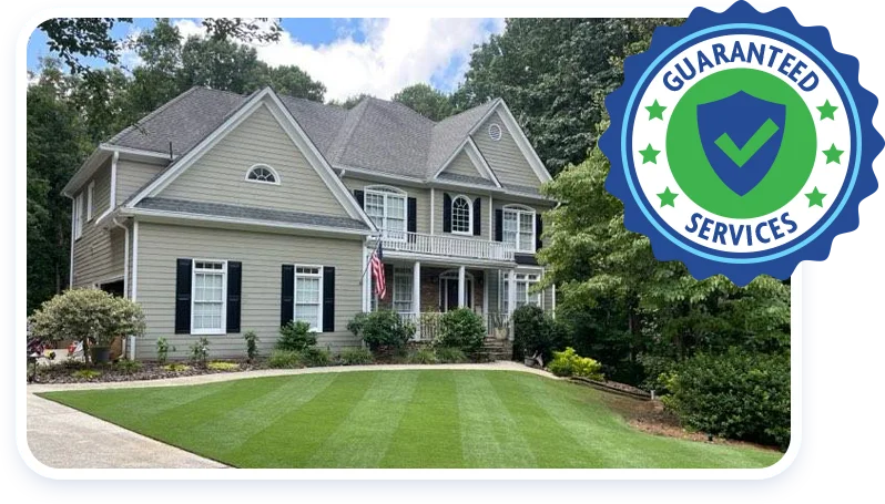 guaranteed services badge, house with green lawn