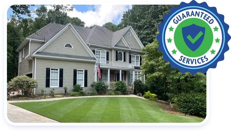 guaranteed services badge, house with green lawn