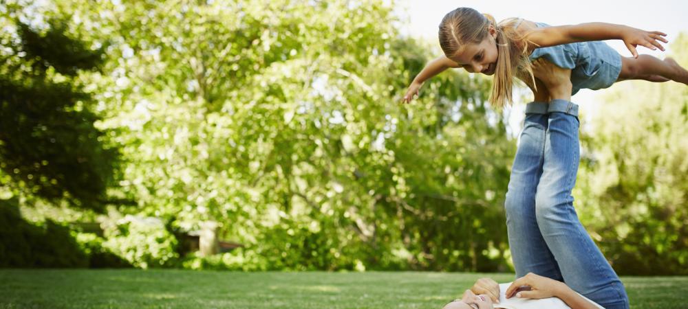 Mother and daughter playing in the yard